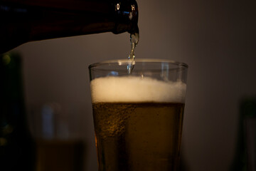 Pouring Cold Beer Into Glass