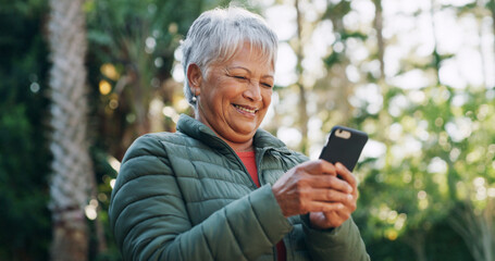 Nature, happy and senior woman with phone for texting, communication or mobile app for weekend...