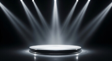 A circular stage with a black edge, illuminated by three bright spotlights in a dark room