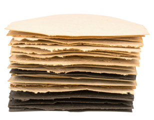 A stack of layered paper sheets in varying shades, showcasing texture and thickness, with visible edges and folds.