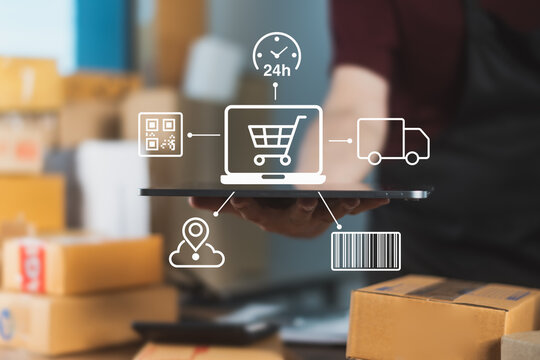 E-commerce seller holding tablet with icons representing 24/7 online shopping, barcode tracking, delivery, and smart logistics system