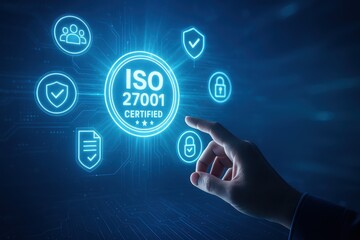 ISO 27001 Certification: Digital hand activates ISO 27001 icon, symbolizing data security, privacy, and digital governance, against a dark background.