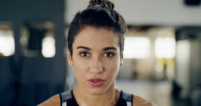 Fitness, portrait and serious with woman in gym for start of training or workout routine. Break, breathing and intensity with athlete or bodybuilder in health club for challenge or improvement