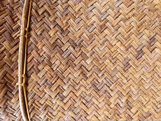 In the picture is the pattern and weaving of bamboo and light brown rattan. It is weaving for use and decoration in various events. It is a beautiful pattern and has the art of weaving in detail.