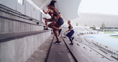 Fitness, running and stairs with people in stadium together for competition, training or workout....