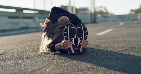 Fitness, woman and stretching on road for wellness, health and preparation for exercise in city....