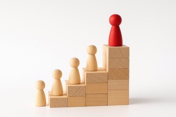 This image symbolizes effective leadership and teamwork, showcasing a red pawn at the top of a staircase made of wooden blocks, representing the journey of guiding others towards success and growth.