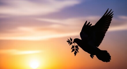 Silhouette of a dove flying with an olive branch in its beak against a beautiful sunset sky, symbolizing peace and hope