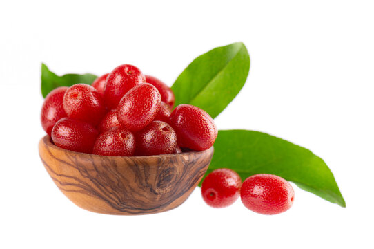Elaeagnus multiflora isolated on white background. Cherry elaeagnus or cherry silverberry in wooden bowl. Goumi or gumi berry.