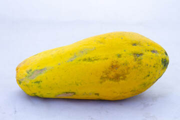 A fresh ripe yellow pawpaw isolated on a clear background with copy space