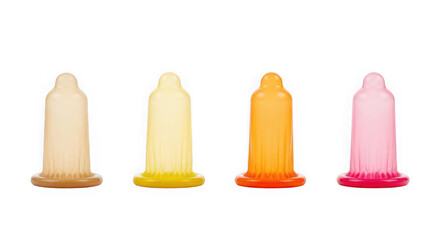 Four colorful condoms standing upright showcasing their different shades and textures isolated on transparent background