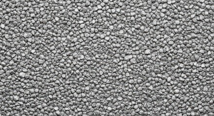 Fototapeta premium Close up overhead view of a dense uniform scattering of small light gray textured pebbles or gravel