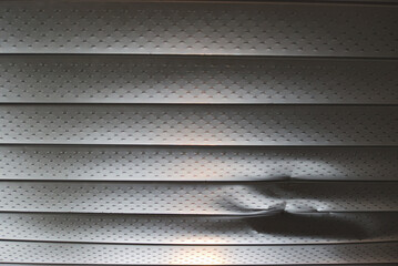 Dented metal soffit