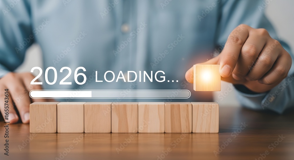 Poster person placing wooden block on row with loading bar and 2026 text indicating future year