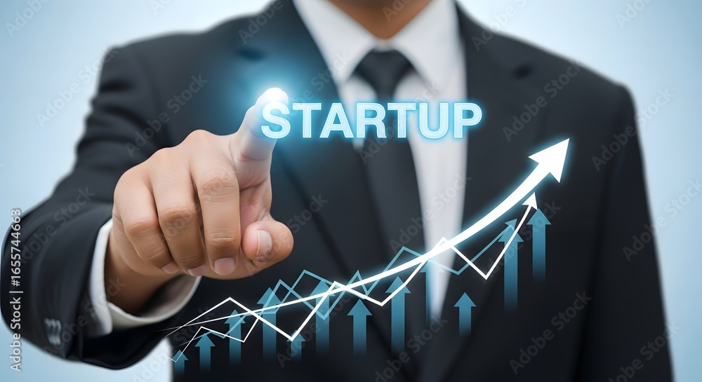 Poster businessman pointing at startup text with upward trending graph on a blue gradient background