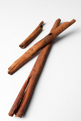 Cinnamon sticks isolated on white background, aromatic spice ingredient for cooking, baking, tea, and natural herbal health remedies.