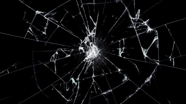 Glass Shattered and Breaks with Bullet Hit, cracks glass fracture effect texture isolated abstract black background.
Abstract cracked screen effect with intricate jagged fractures 