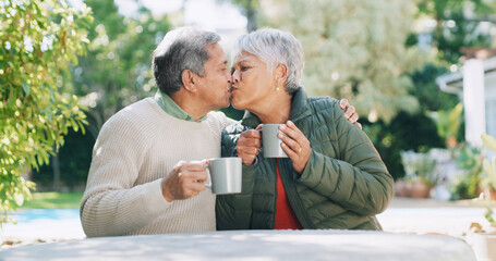 Backyard, kiss and senior couple with coffee for affection, bonding and relaxing outdoor Retirement home, marriage and mature man and woman with drink for relationship, love and commitment in garden