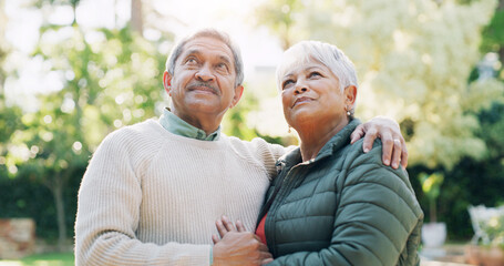 Thinking, embrace and senior couple in park, relationship and bonding together with contemplation. Outdoor, memory and man with woman, choice and retirement with marriage, love and daydreaming
