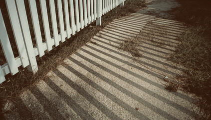 White fence on a sunny day.