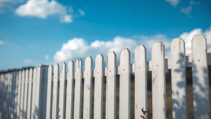 White fence on a sunny day.