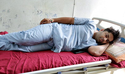 Patient Resting in Hospital Bed Post Surgery in Medical Ward