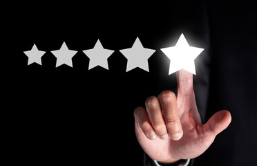 Businessman hand touching five star symbol to increase rating of company concept, Copy space...