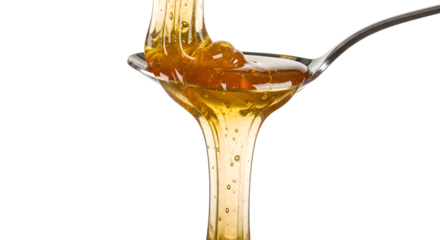 Honey pours from a spoon with a Transparent Background, showing its golden color and texture