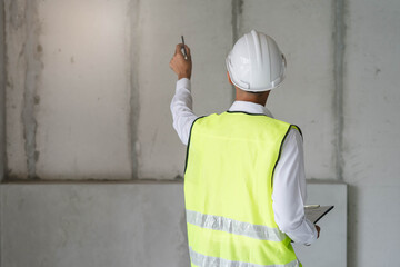 Builder inspection consultancy. Inspector checking material and structure in construction.