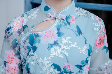 An Asian girl in a blue Tang suit