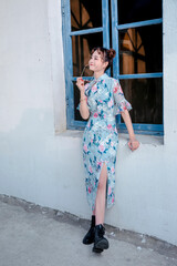 An Asian girl in a blue Tang suit