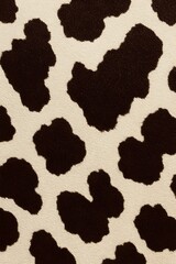 Obraz premium Trendy cow print background evokes playful, modern designs and stylish interiors for creative projects