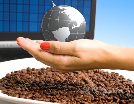 Hand holding globe over coffee beans - Powered by Adobe