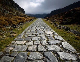 Stone path receding into a mountain pass under a cloudy sky