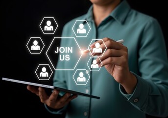Person using a tablet with join us graphic and people icons in a dark background setting image