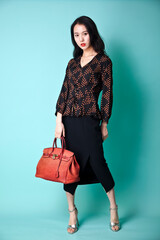An Asian girl in fashionable clothes