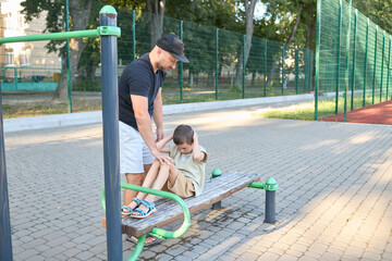 Father and a small son doing a workout session