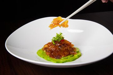 Close-up of Jellyfish Salad, Chopsticks Holding for Display, Traditional Chinese Food