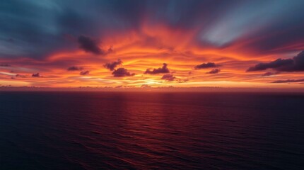 Vivid sunset over a calm ocean featuring colorful sky and water reflections