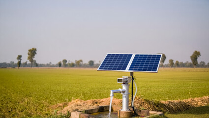 Solar powered water pump is in a field