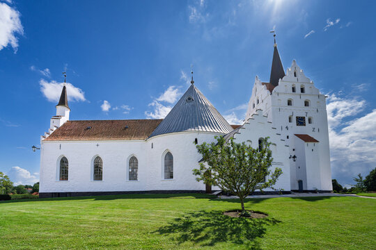 Historic White Horne Church with Tower Under a Vibrant Blue Sky, Faaborg, Denmark