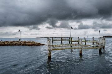 Rustic Pier Overlooking the Ocean Under Dramatic Cloudy Skies, Faaborg, Denmark