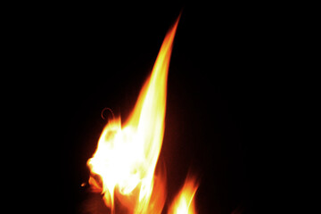 Close up burning flames on black background for graphic design or wallpaper.