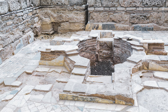 Close-up of ancient baptistery in the Church of the Apocalypse, Laodicea, Turkey, with marble structure and mosaic floor