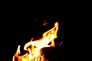 Close up burning flames on black background for graphic design or wallpaper.