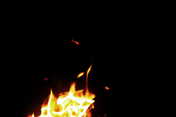 Close up burning flames on black background for graphic design or wallpaper.