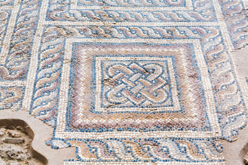 Colorful ancient mosaic floor pattern with interwoven design in Laodicea, Turkey