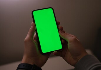 a man hand holding phones with green screen