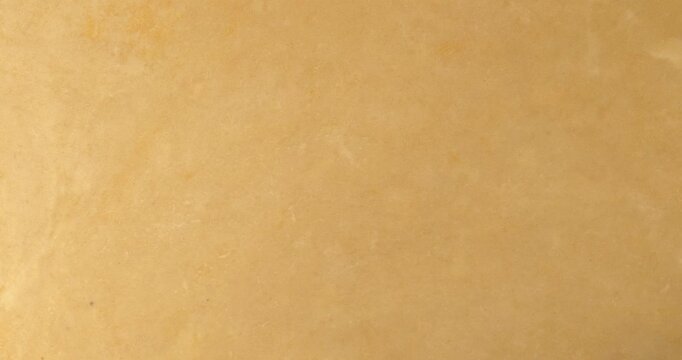 The process of rolling out the dough. Preparing the dough for baking quiche.