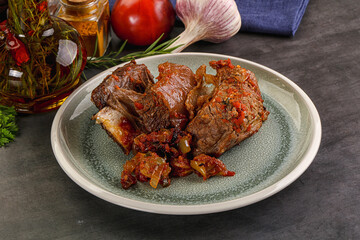 Baked beef ribs with vegetables